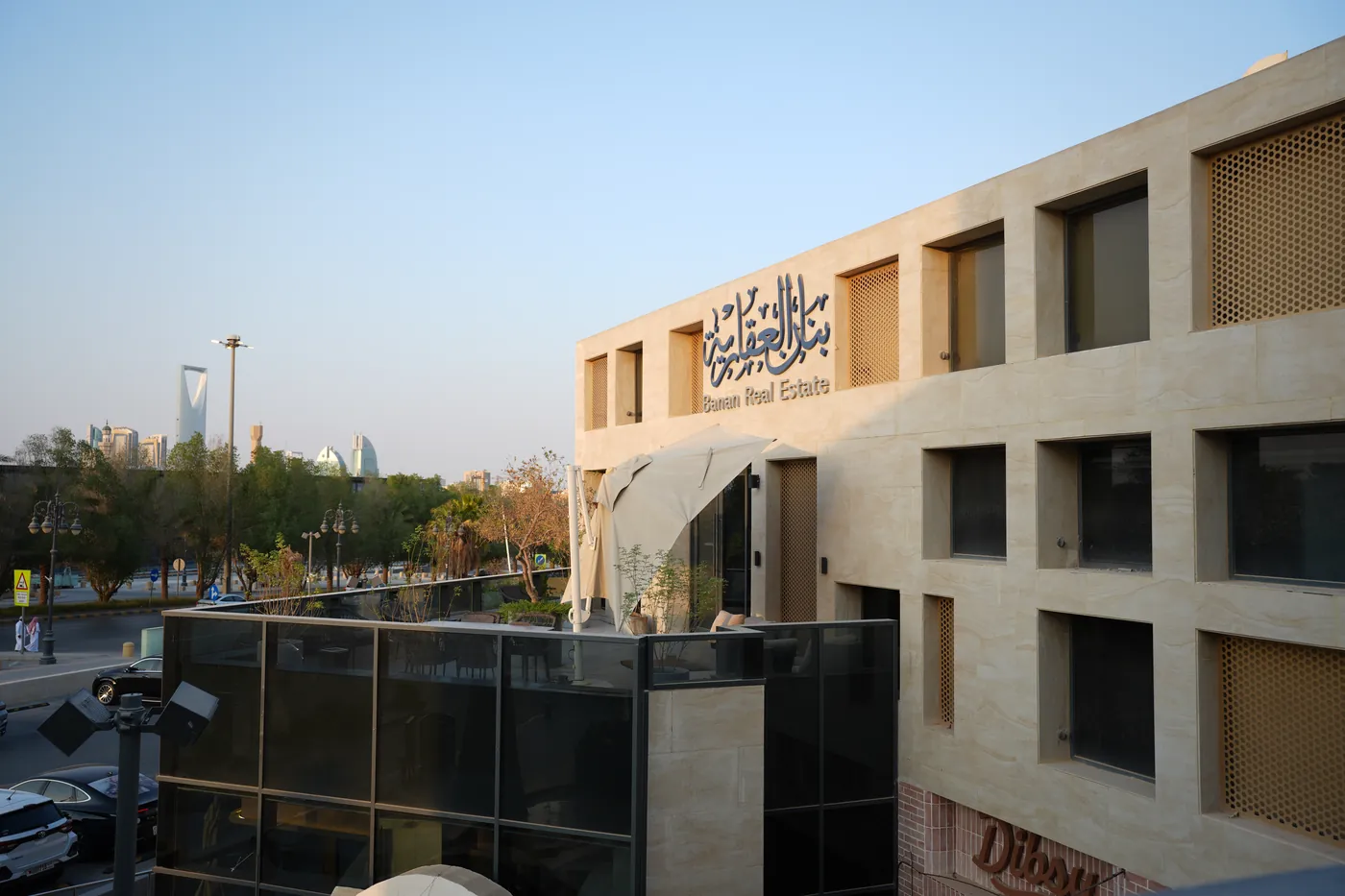The Banan Real Estate building in Riyadh, with Kingdom Centre in the background