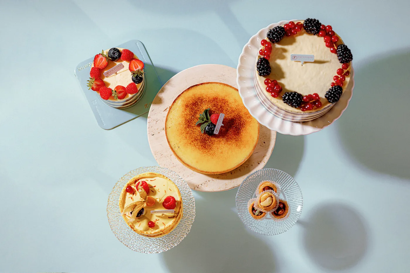 A spread of Exception Sweets cakes and tarts, shot from above