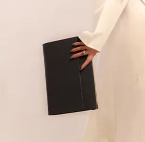Product photo: a black leather folder